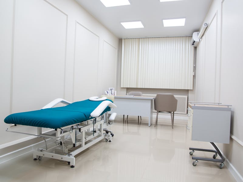 Clean modern medical exam room — medical and dental cleaning