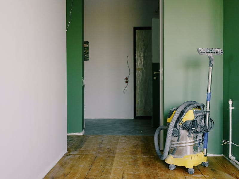 Post-construction cleaning — vacuuming a renovation site