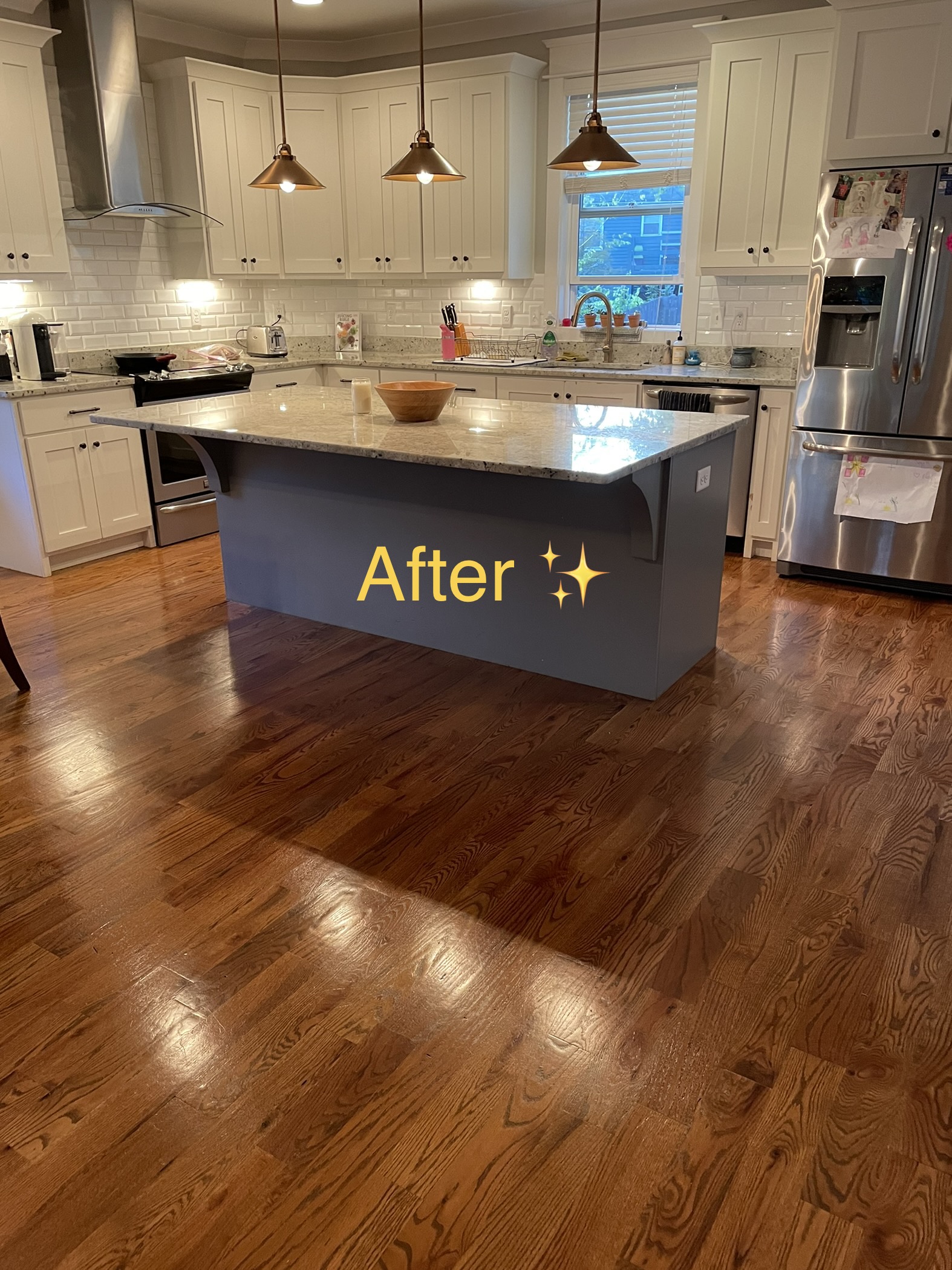 Same kitchen after Tidy Guys cleaning — gleaming hardwood floors, spotless surfaces