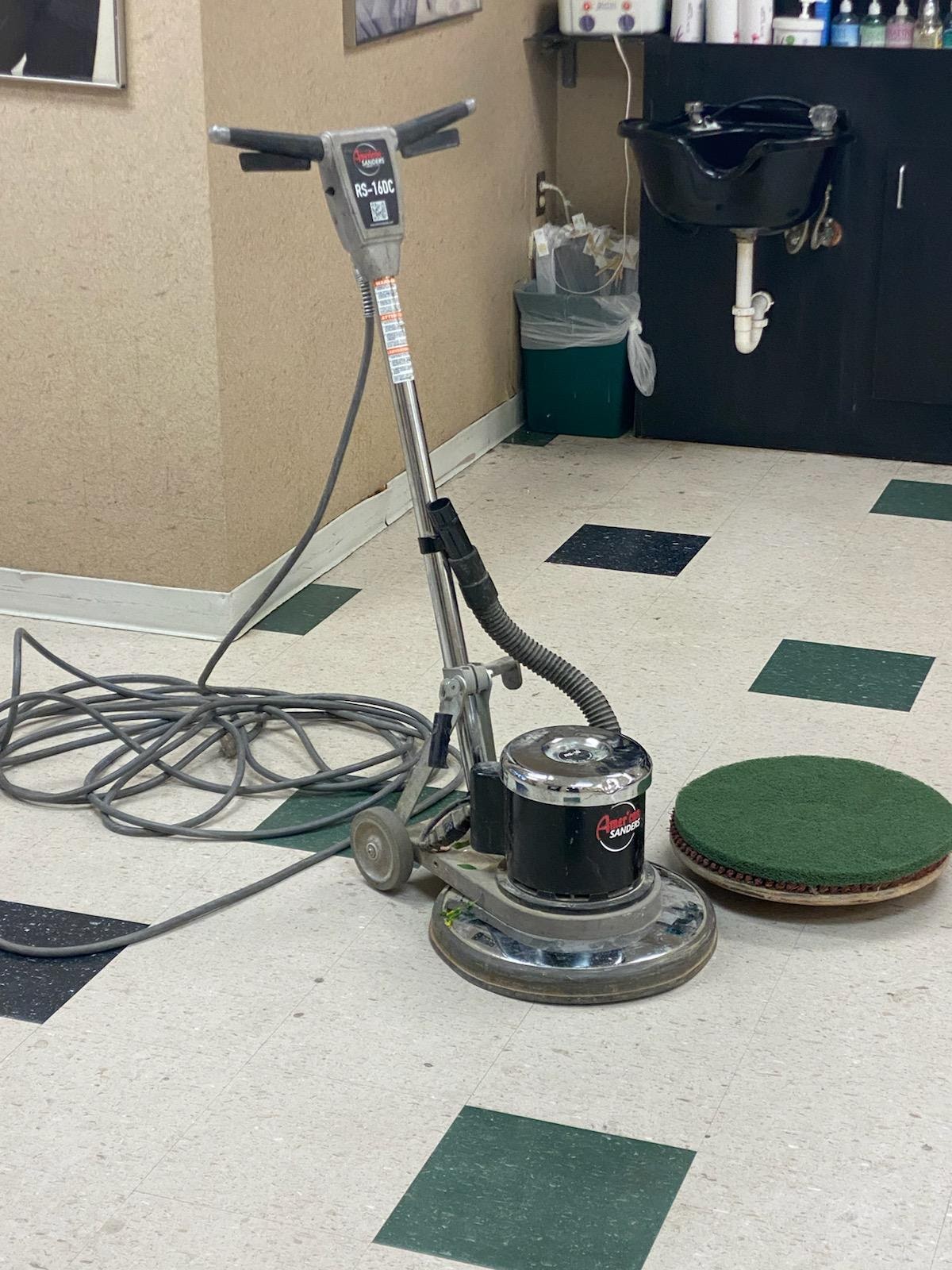 Commercial floor buffer machine on VCT tile — janitorial services